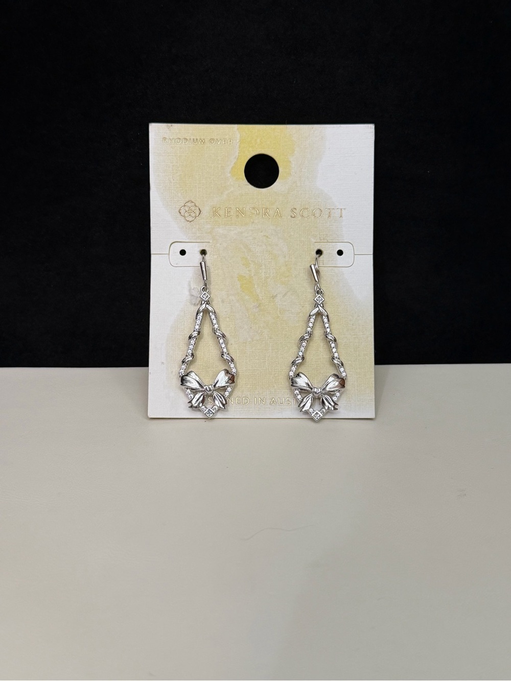 NWT Kendra Scott Rhodium Bow Twisted Teardrop Drop Earrings